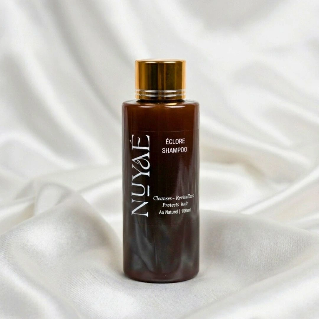 Nuyaé Éclore botanical black soap shampoo in minimalist bottle
